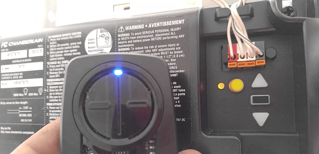 Programming New Garage Door Remote By Strongman Garage Doors ensuring reliable and safe garage door operation for residential customers