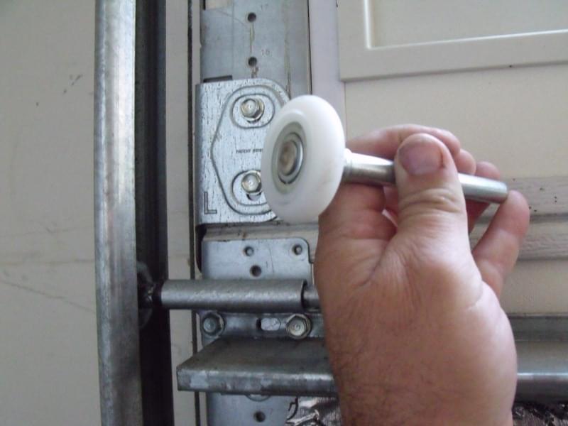 Repairing & Replacing Garage Door Rollers By Strongman Garage Doors ensuring reliable and safe garage door operation for residential customers